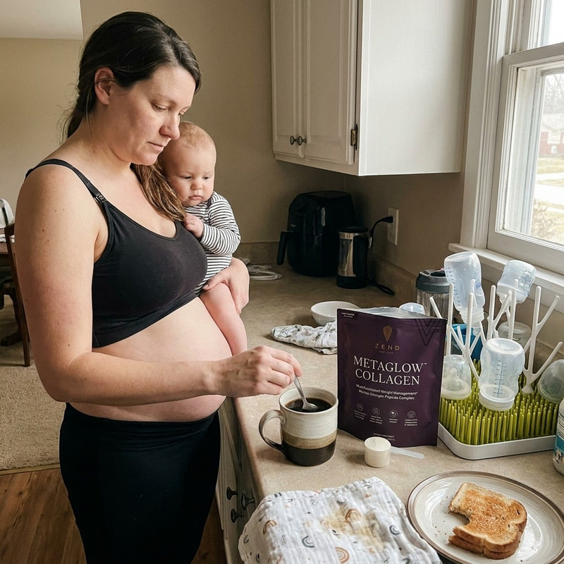 A mother at her kitchen counter, baby on her hip, stirring a scoop of MetaGlow into her coffee